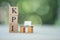 Wooden block with KPI near miniature office table.