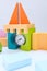 Wooden block tower with a clock made by a child. Early education development toys