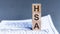 Wooden block with words HSA - acronim HSA - Health Savings Account. . HSA Health Savings Account Wooden Blocks on Grey background