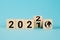 Wooden Blocks With changing number 2021 2022. New year concept. Copy space. Cube block flipping from 2021 to 2022 on a