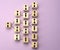 Wooden blocks with figures on a lilac background, hierarchical organizational structure of management, gender balance, effective