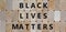 Wooden blocks form the words `black lives matters`. Beautiful wooden background. Concept image