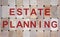 Wooden blocks form the words `estate planning`. Beautiful wooden background