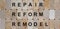 Wooden blocks form the words `repair reform remodel`. Beautiful wooden background. Business concept