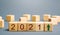 Wooden blocks with the inscription 2021 and an up arrow. The forecast concept for 2021. Business forecasting. Growth and