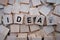 Wooden blocks with letters spelling Idea.