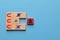 Wooden blocks with magnet icons pull a person in a row block. Recruiting and search talent workers concept