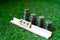Wooden blocks with PPF for public provident fund called out on them and a stack of coins stacked like a growing graph on