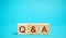 Wooden blocks Q&A  question and answer concept. Communication, brainstorming, business. Search for information. Ask for an