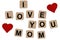 Wooden blocks spelling the inscription I love you on mom