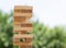 Wooden blocks stacked on top of each other to build a business strategy, success ladder in a business growth concept, education,