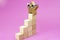 wooden blocks stairs leading to a golden star with sun shades