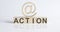 Wooden Blocks with the text: Action with wooden sign e-mail