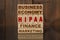 Wooden blocks with the text - Business, Economy, Finance, Marketing and HIPAA