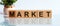 Wooden Blocks with the text: MARKET. New business relaunch startup concept