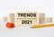 Wooden blocks with text Trends 2021 with sharpener and pencil