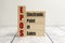 wooden blocks with the word epos on white background