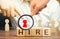 Wooden blocks with the word Hire. Headhunter selects a person from the crowd. Good choice. Human Resource Management. Recruiting