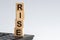 Wooden blocks with the word Rise. Business and finance concept