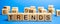 Wooden blocks with the word Trends. Popular and relevant topics. New ideological trends. Recent and latest trend