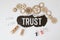 Wooden blocks with the word Trust. Trust relationships between business partners, friends, relatives