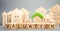 Wooden blocks with the word Valuation and many houses. Resale residential property condition. The study of the state of the house