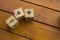 Wooden blocks with the words lie on the table. Wooden cubes with letters and symbols.