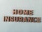 Wooden blockswith words home Insurance. Wooden blocks with lettering on top of white background. Insurance concepts