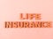 Wooden blockswith words life  Insurance. Wooden blocks with lettering on top of white background. Insurance concepts