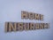 Wooden blockswith words life  Insurance. Wooden blocks with lettering on top of white background. Insurance concepts