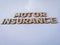 Wooden blockswith words motor Insurance. Wooden blocks with lettering on top of white background. Insurance concepts