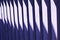 Wooden blue vertical slats, boards with a bright stripe of the Sun. Finishing element. Abstract background