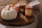 Wooden board with beautiful pumpkins and candles indoors