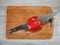 Wooden board for cutting foods on the table in the kitchen.