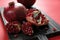 Wooden board with delicious ripe pomegranates on color background