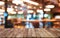 Wooden board empty table background. blurred restaurant and cafe background