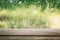 Wooden board empty table in front of blurred rainy window