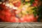 Wooden board empty table in front of colorful blurred background. Perspective brown wood over bokeh light