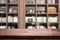 Wooden board empty table space platform in front of blurred library Of The background - can be used for display or montage your p