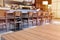 Wooden board empty table top in front of blurred cafe or restaurant background, for display or montage products