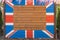 Wooden board with painted Great Britain Union jack flag. British country national symbol. Empty copy space for text in center