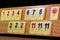 Wooden board with pieces of rummy game