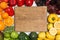 Wooden board in rainbow frame of fruits