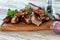 Wooden Board With Roasted Spareribs And Sausages