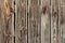 Wooden boards faded texture background with different sizes of wooden boards nailed with rusted nails