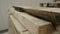 Wooden boards for pallets. Piles of wooden boards in the sawmill, planking. Warehouse for sawing boards on a outdoors