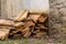 Wooden boards pile of sawed materials pattern traditional material near the rock wall shed