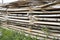Wooden boards are stacked to dry. New planed birch boards lie in a heap. Pile of wooden boards