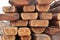 Wooden boards in the warehouse of building materials. Wooden building materials. Stacks of lumber are stored in a