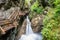 Wooden boardwalk leads through a tight canyon over whitewater, S